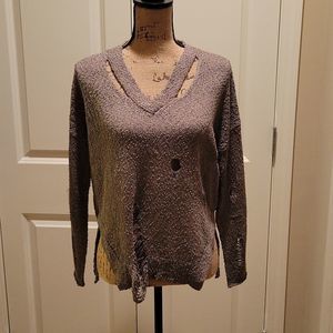 NWT Woman's distressed sweater. V-neck with slaches under the neck